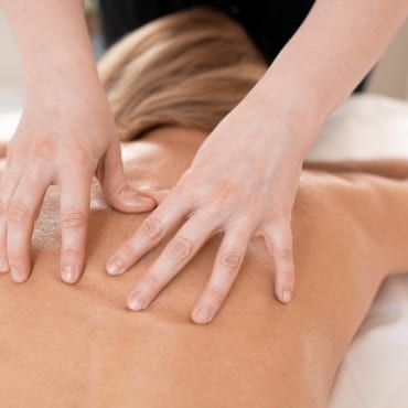 A woman receiving massage therapy